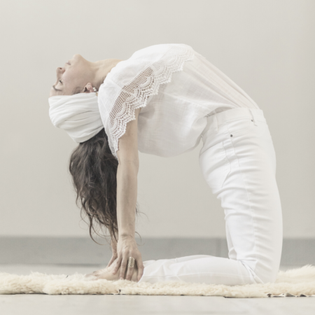 A woman practicing Kundalini Yoga