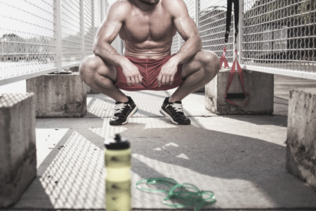 A man finishing a intense workout of HIIT training.